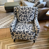 Fusion Barrington Accent Chair with plush fabric and wooden legs, stylishly designed for modern living rooms.