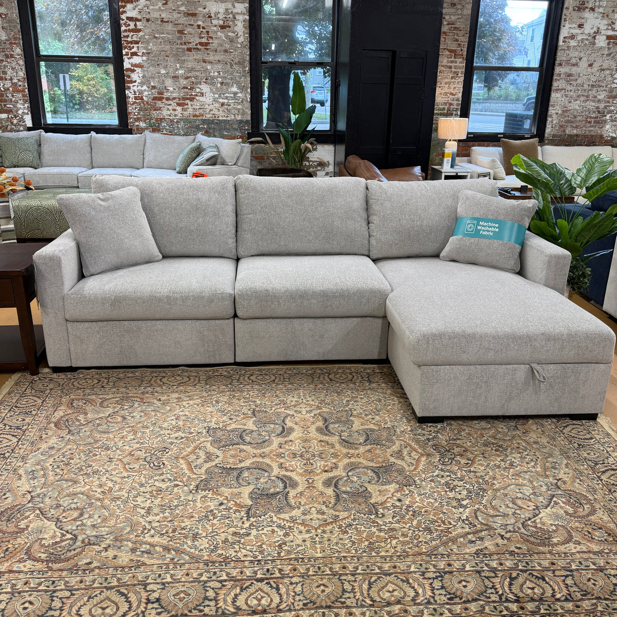 Ashley Furniture Haven 3-piece sectional with chaise, featuring plush cushions and modern design, ideal for a contemporary living room.