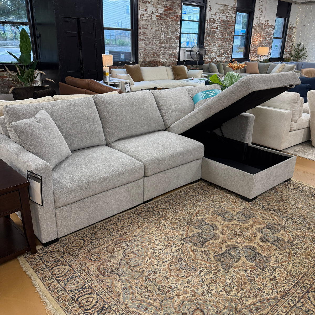 Ashley Furniture Haven 3-piece sectional with chaise, showing plush gray upholstery and modern design in a living room setting.