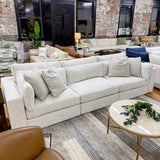 Alpine 3-piece sectional sofa by Ashley Furniture with plush cushions and modern design, shown in a cozy living room setting.