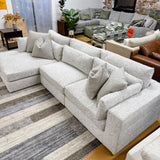 Ashley Furniture Alpine 3-piece sectional with chaise, showing plush fabric upholstery and modern design in a stylish living room setting.