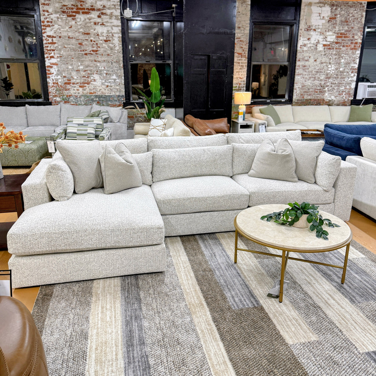 Ashley Furniture Alpine 3-piece sectional with chaise, featuring plush cushions and modern design for comfortable living room seating.