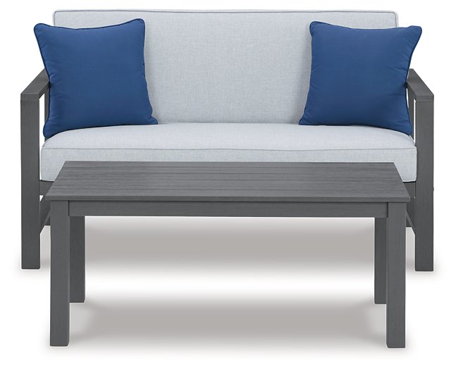 Fynnegan Outdoor Loveseat with Table (Set of 2) - Pull Up A Couch