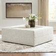 Large Alpine oversized ottoman by Ashley Furniture, featuring plush fabric and a spacious surface for living room decor.
