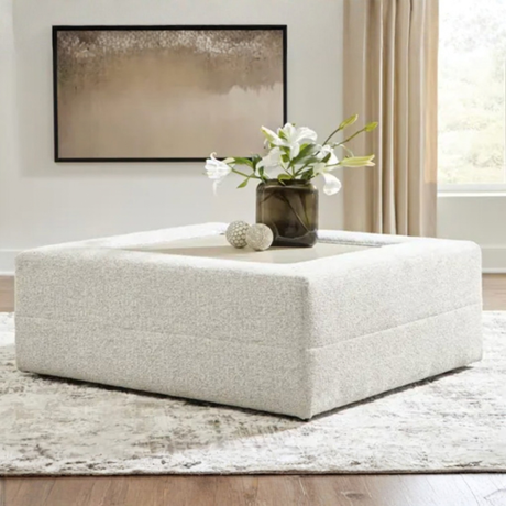 Large Alpine oversized ottoman by Ashley Furniture, featuring plush fabric and a spacious surface for living room decor.
