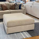 Behold Home Sequoia Accent Ottoman with wooden legs and plush fabric upholstery, ideal as a stylish footstool or side table.
