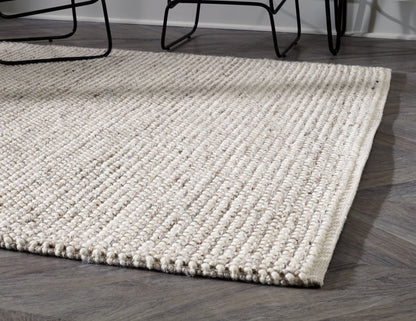 Jossick 7'8" x 10' Rug - Pull Up A Couch