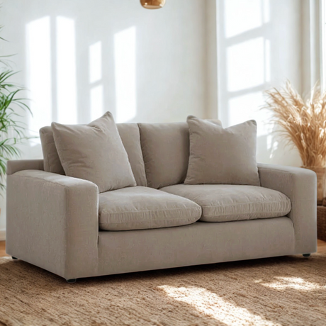 Ashley Furniture Nova Cloud loveseat with plush fabric, featuring a cozy, modern design and cushioned armrests.