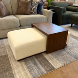 Pull Up A Couch Stafford Ottoman with castered table, featuring a plush fabric top and sturdy wooden legs for versatile use.