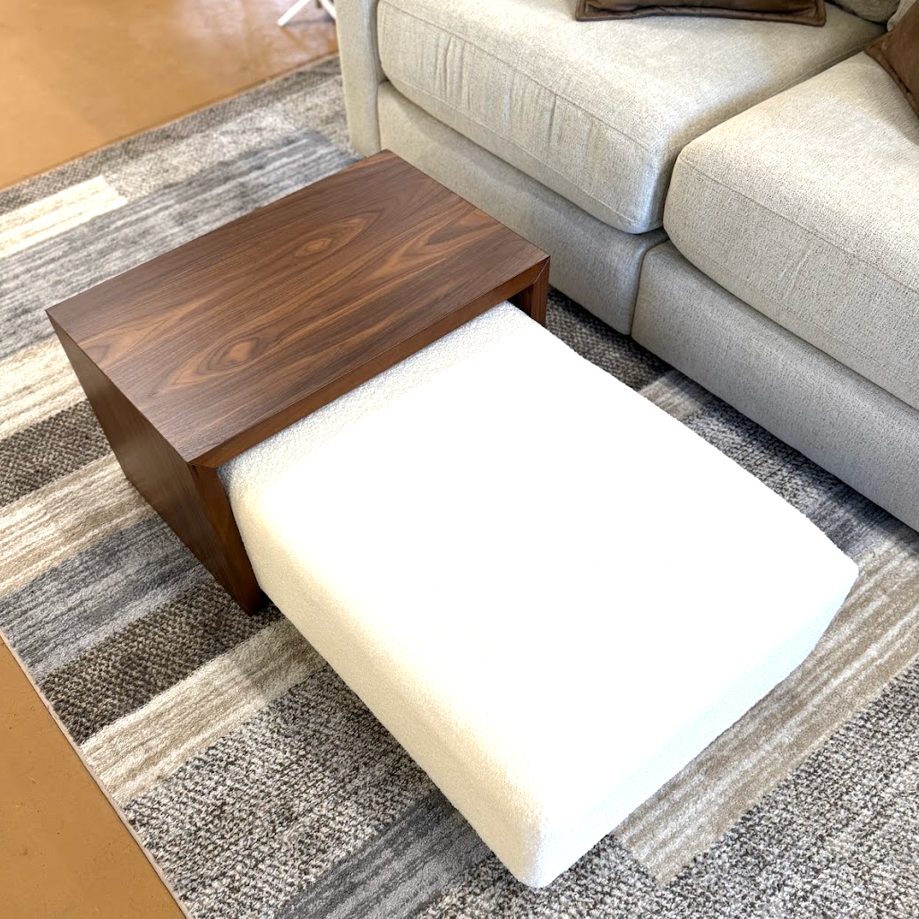 Pull Up A Couch Stafford Ottoman with castered table, featuring a cushioned top and stylish wooden legs for versatile living room use.