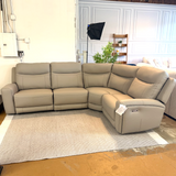 Ashley Furniture Salerno Power Reclining Sectional, a modern 4-piece sectional sofa with reclining features and plush cushions.