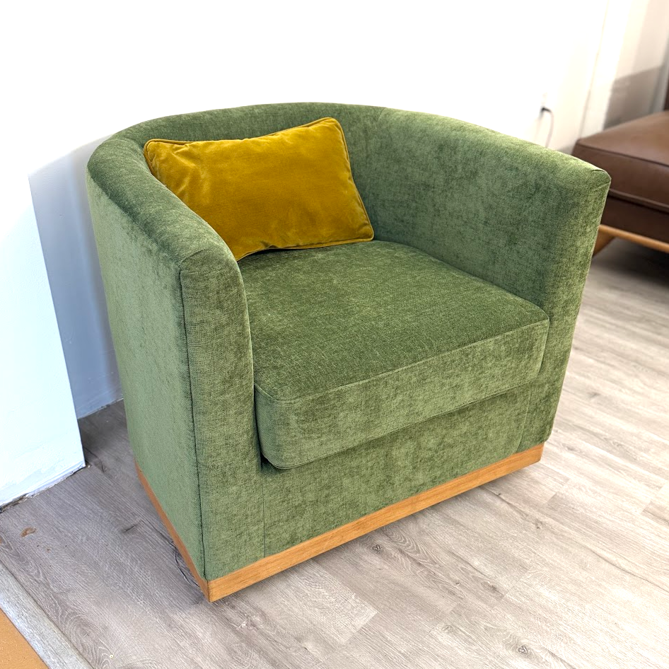 Ashley Furniture Jersonlow swivel chair with a modern design and cushioned seat, shown in a neutral fabric finish.