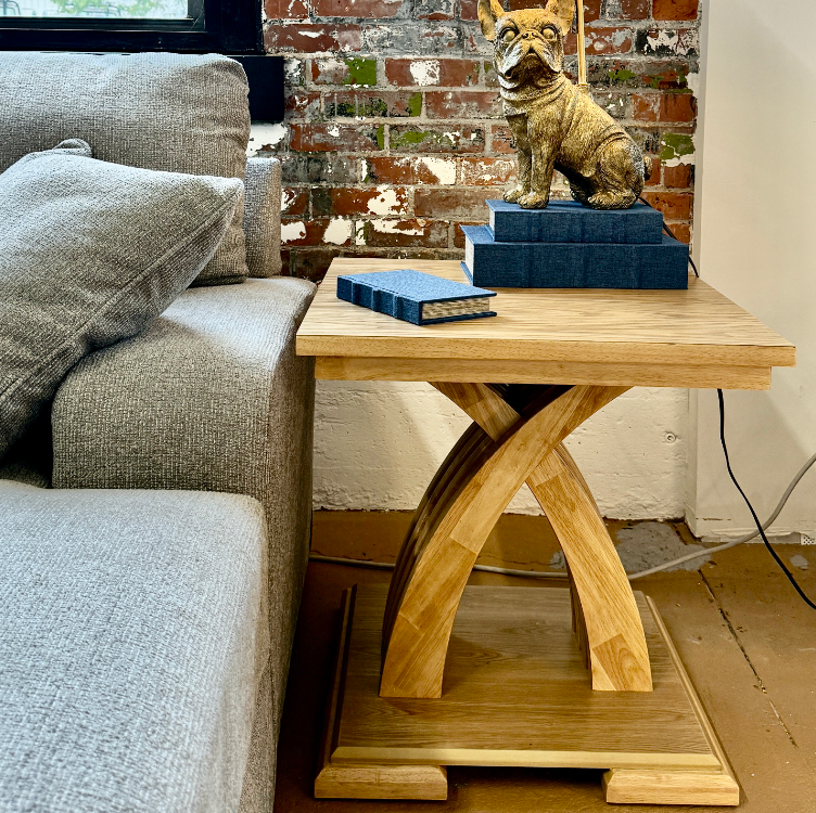 Pull Up A Couch Lamia End Table with a sleek wooden surface and modern design, perfect for living room decor.