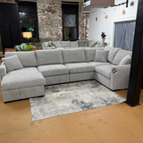 Ashley Furniture Haven 5-piece modular sectional with chaise, featuring plush upholstery and contemporary design for versatile living room setup.