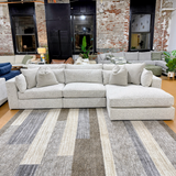Ashley Furniture Alpine 3-piece sectional with chaise, featuring plush cushions and modern design for comfortable living space.