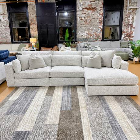 Ashley Furniture Alpine 3-piece sectional with chaise, featuring plush cushions and modern design for comfortable living space.