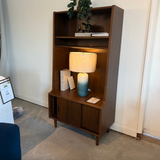 Walnut MCM bookcase with storage compartments by Article, featuring sleek modern design and ample space for books and decor.