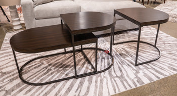 Set of three Ashley Furniture Vanmore tables displaying modern wooden tabletops and sturdy metal legs.