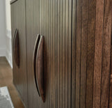 Ashley Furniture Amickly accent cabinet with a modern design, featuring a sleek wood finish and stylish storage compartments.