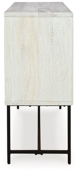 Ashley Furniture Freyton Accent Cabinet with wood finish, featuring storage drawers and decorative hardware in a stylish home decor setting.
