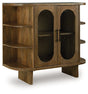 Ashley Furniture Niall Accent Cabinet with closed doors, wood finish, and modern design, suitable for living room or hallway decor.