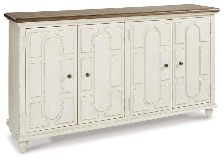 Ashley Furniture Roranville accent cabinet with wood finish, featuring doors and storage compartments, ideal for living room decor.