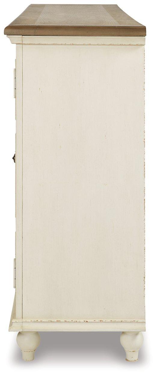 Ashley Furniture Roranville accent cabinet with wood finish, featuring storage drawers and elegant design for living room decor.