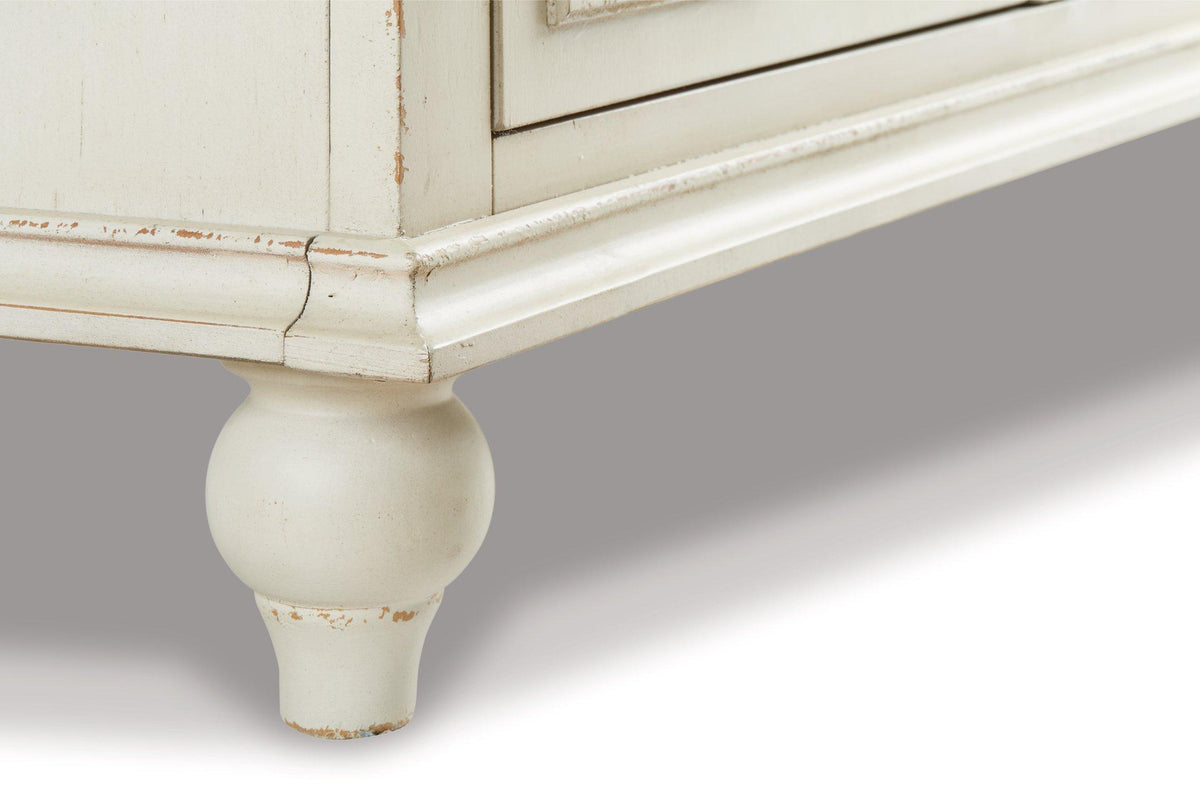 Ashley Furniture Roranville accent cabinet with wood finish and decorative hardware, ideal for living room or hallway storage.