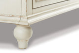 Ashley Furniture Roranville accent cabinet with wood finish and decorative hardware, ideal for living room or hallway storage.