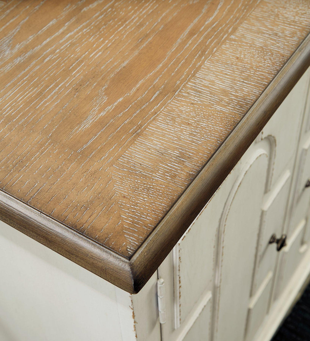 Ashley Furniture Roranville accent cabinet with wood finish, featuring storage drawers and decorative design.