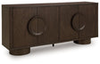 Ashley Furniture Veeda Accent Cabinet with closed doors, featuring a sleek design and wooden finish, shown from an angled perspective.