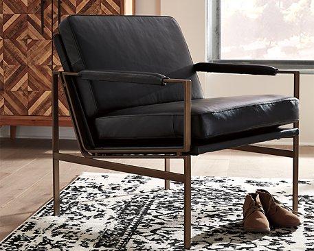 Ashley Furniture Puckman Accent Chair with plush fabric and modern design, perfect for living rooms or bedrooms.