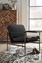 Ashley Furniture Puckman Accent Chair with plush fabric upholstery and modern design, shown in a stylish living room setting.