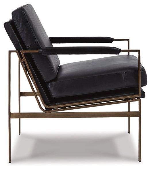 Ashley Furniture Puckman accent chair with plush fabric, stylish design, and wooden legs, perfect for living room or lounge spaces.