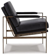 Ashley Furniture Puckman accent chair with plush fabric, stylish design, and wooden legs, perfect for living room or lounge spaces.