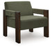 Ashley Furniture Adlanlock accent chair with plush fabric and wooden legs, shown from a side angle with modern design details.