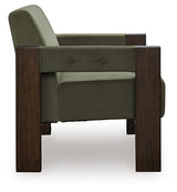 Ashley Furniture Adlanlock accent chair with plush fabric and wooden legs, shown from a side view.
