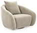 Ashley Furniture Yahya swivel accent chair with plush upholstery and modern design, shown from an angled side view.