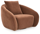 Ashley Furniture Yahya swivel accent chair with plush upholstery and modern design, shown from an angled side view.