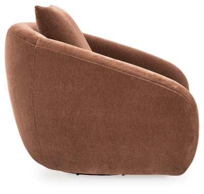 Ashley Furniture Yahya swivel accent chair with plush upholstery and wooden legs, shown from a side angle.