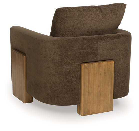 Ashley Furniture Dairlett accent chair with plush fabric, wooden legs, and a stylish, modern design.