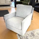 Freybourne swivel accent chair by Ashley Furniture with plush upholstery and modern design, shown in a cozy living room setting.