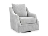 Ashley Furniture Gubbins swivel accent chair with a rounded back and plush cushion, shown from an angled side view.