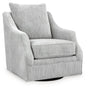 Ashley Furniture Gubbins swivel accent chair with a plush upholstered seat and modern design, shown from an angled side view.