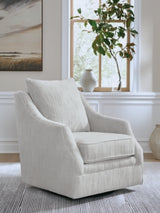 Ashley Furniture Gubbins swivel accent chair with plush fabric and modern design, shown in a cozy living room setting.