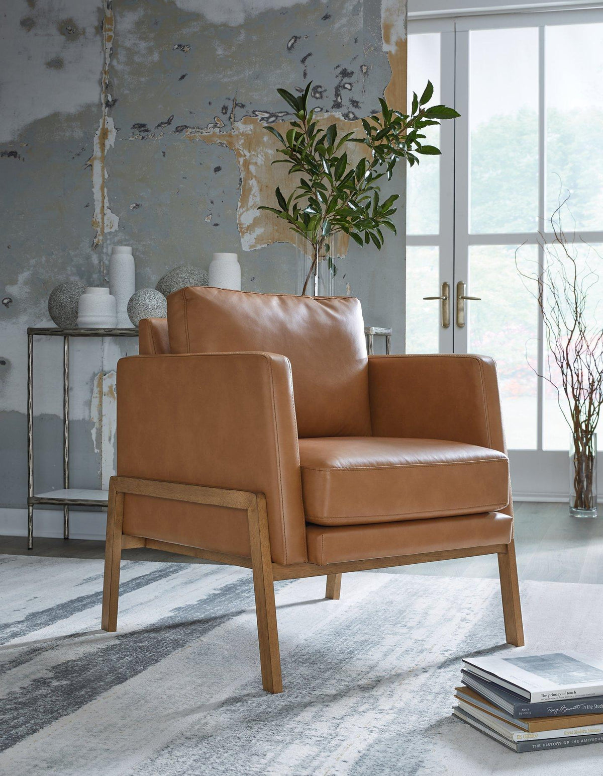 Ashley Furniture Numund accent chair with plush fabric and modern design, perfect for living room or lounge area.