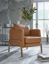 Ashley Furniture Numund accent chair with plush fabric and modern design, perfect for living room or lounge area.