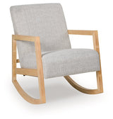Ashley Furniture Wychworth accent chair with plush beige upholstery and wooden legs, shown from an angle.