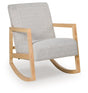Ashley Furniture Wychworth accent chair with plush beige upholstery and wooden legs, shown from an angle.