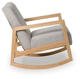 Ashley Furniture Wychworth accent chair with plush fabric and wooden legs, shown from a side view.